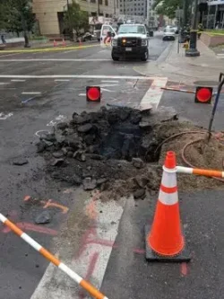 Downtown Denver underground explosion rockets manhole covers into air, sparks fire, injures one