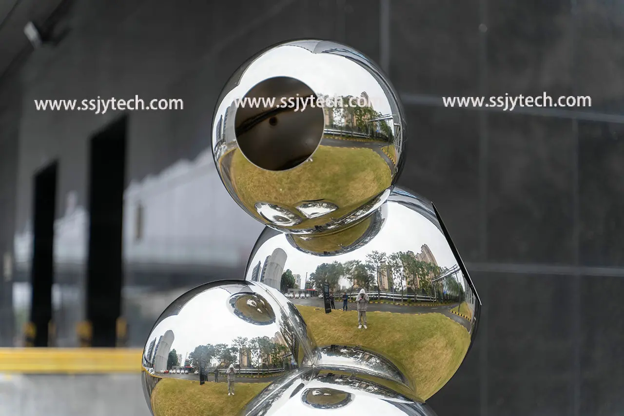 Stainless steel sphere sculpture of grass in outdoor park square (7)