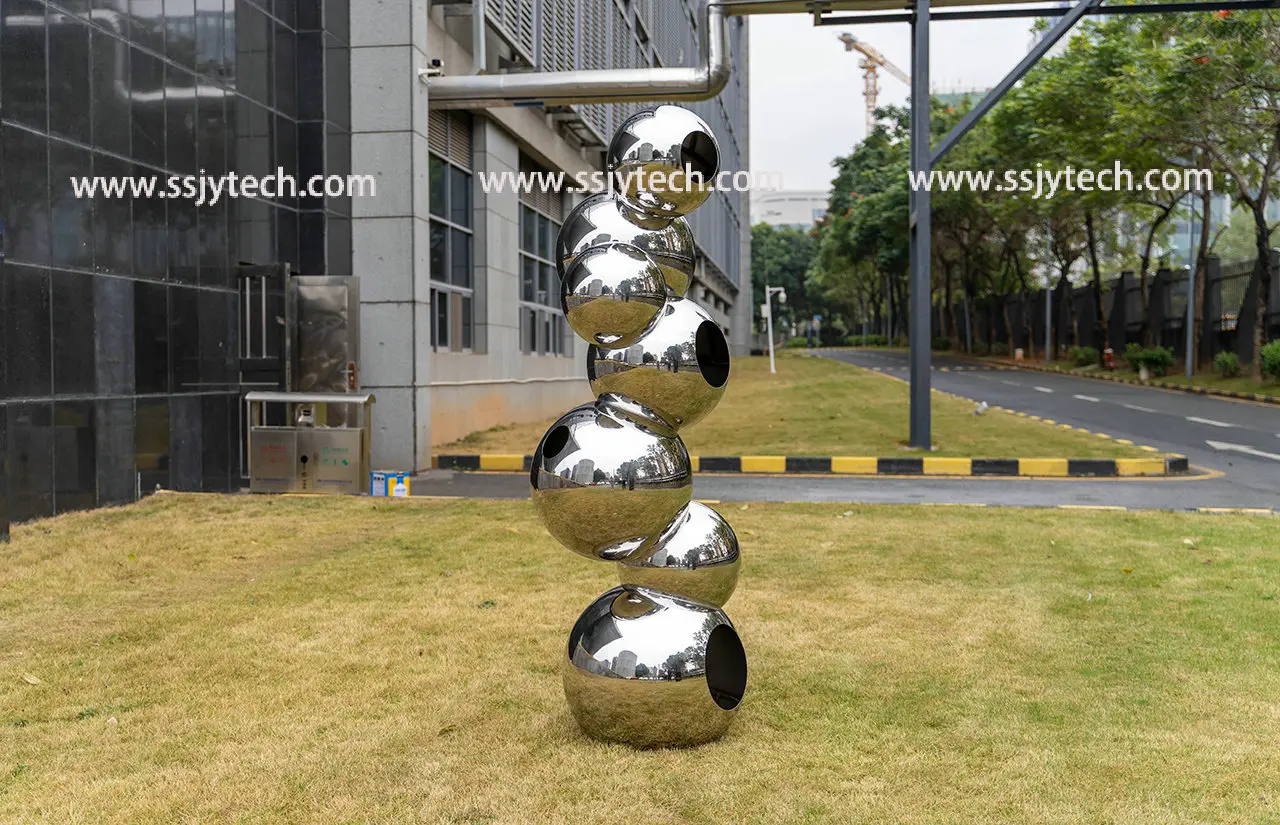 Stainless steel sphere sculpture of grass in outdoor park square (5)