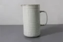 Water jug with woven lines design